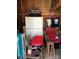 Organized shed interior featuring a refrigerator, television, and storage solutions at 113 Larboard Trl # B36/37, Mount Gilead, NC 27306