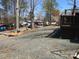 Street view showing parking spaces, storage and other ammenities in the neighborhood at 113 Larboard Trl # B36/37, Mount Gilead, NC 27306