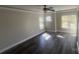 Bright bedroom featuring wood floors, large windows and white trim at 1134 Riverside Dr, Charlotte, NC 28214