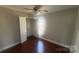 A bedroom with wood floors and a closet with bifold doors at 1134 Riverside Dr, Charlotte, NC 28214