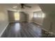 Spacious bonus room featuring dark floors and many windows at 1134 Riverside Dr, Charlotte, NC 28214