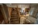 View of the garage with stairs and storage shelving, ready for customization and organization at 1134 Riverside Dr, Charlotte, NC 28214