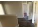 Hallway featuring dark floors and views into multiple rooms at 1134 Riverside Dr, Charlotte, NC 28214