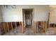 A living room being renovated and down to its studs at 1134 Riverside Dr, Charlotte, NC 28214