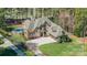 Expansive property featuring a beautiful pool, lush landscaping, and a stately home at 115 Stonewall Beach Ln, Mooresville, NC 28117