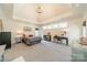 Bright primary bedroom featuring a high ceiling, natural light, and elegant chandelier at 115 Stonewall Beach Ln, Mooresville, NC 28117