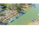 Aerial view of multiple boat docks with boats parked along the Lake Norman shoreline at 115 Stonewall Beach Ln, Mooresville, NC 28117