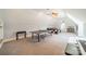 Spacious bonus room complete with a ping pong table, carpet, and lots of natural light at 115 Stonewall Beach Ln, Mooresville, NC 28117