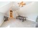 Bright bonus room presents a ping pong table for entertainment and a relaxed setting at 115 Stonewall Beach Ln, Mooresville, NC 28117
