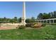 Scenic monument on a green lawn with surrounding landscaping and pergola at 115 Stonewall Beach Ln, Mooresville, NC 28117