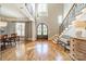 Grand foyer with hardwood floors, soaring ceilings, elegant staircase, and lots of natural light at 115 Stonewall Beach Ln, Mooresville, NC 28117