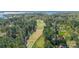 Scenic aerial shot of a golf course lined with trees, showcasing the lush green fairways at 115 Stonewall Beach Ln, Mooresville, NC 28117
