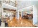 Open concept living space with hardwood floors, elegant decor, and abundant natural light at 115 Stonewall Beach Ln, Mooresville, NC 28117