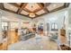 Bright and open living area with coffered ceiling, hardwood floors, and seamless flow at 115 Stonewall Beach Ln, Mooresville, NC 28117