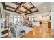 Spacious living area featuring hardwood floors, designer furniture, and access to the outdoors at 115 Stonewall Beach Ln, Mooresville, NC 28117