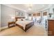 Tranquil main bedroom with natural light, neutral tones, and elegant decor at 115 Stonewall Beach Ln, Mooresville, NC 28117