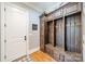 Well-organized mudroom with custom wood lockers, drawers, and bench seating at 115 Stonewall Beach Ln, Mooresville, NC 28117
