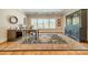 Large office features hardwood floors, a vintage rug, and ample natural light at 115 Stonewall Beach Ln, Mooresville, NC 28117