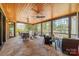Inviting covered patio with stone floors and views of the green landscape and the golf course at 115 Stonewall Beach Ln, Mooresville, NC 28117