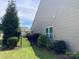 Landscaped backyard with manicured lawn, privacy fence and mature trees at 116 Water Ski Dr, Statesville, NC 28677
