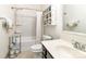 Clean bathroom with shower-tub combo, vanity, and shelving unit at 116 Water Ski Dr, Statesville, NC 28677