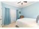 Cozy bedroom with light blue walls, neutral carpet, and a plush armchair at 116 Water Ski Dr, Statesville, NC 28677