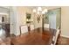 Elegant dining room with dark wood table, decorative chandelier, and stylish decor at 116 Water Ski Dr, Statesville, NC 28677