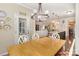 Dining room with wood table and decorative lighting, open to living areas at 116 Water Ski Dr, Statesville, NC 28677