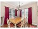Bright dining room with large windows and stylish red curtains at 116 Water Ski Dr, Statesville, NC 28677
