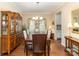 Dining room featuring hardwood floors, traditional furnishings, and a decorative chandelier at 116 Water Ski Dr, Statesville, NC 28677