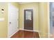 Inviting entryway with hardwood floors, security system, and a decorative glass front door at 116 Water Ski Dr, Statesville, NC 28677
