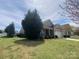 Well-maintained single-story home with manicured front lawn and established shrubbery at 116 Water Ski Dr, Statesville, NC 28677