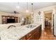 Open kitchen layout with granite counters and a large center island at 116 Water Ski Dr, Statesville, NC 28677