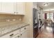 Modern kitchen featuring granite countertops, stainless steel appliances, and views to the dining area at 116 Water Ski Dr, Statesville, NC 28677