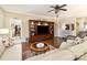 Inviting living room featuring hardwood floors, a large entertainment center, and neutral decor at 116 Water Ski Dr, Statesville, NC 28677