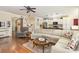 Spacious living room with hardwood floors, comfortable seating, and an open layout to the kitchen at 116 Water Ski Dr, Statesville, NC 28677