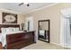 Main bedroom suite with elegant furnishings, mirror, and natural light at 116 Water Ski Dr, Statesville, NC 28677