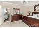 Traditional main bedroom features a wood dresser, mirror, and neutral wall paint at 116 Water Ski Dr, Statesville, NC 28677