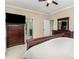 A spacious main bedroom with neutral paint, carpet, and wooden dressers at 116 Water Ski Dr, Statesville, NC 28677