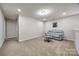 Finished basement featuring neutral carpet flooring, seating area, and ample space at 1211 Croft Dr, Fort Mill, SC 29708