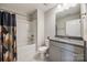 Updated bathroom features vanity with stone countertop and tiled shower/tub combo at 1211 Croft Dr, Fort Mill, SC 29708