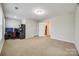 Spacious carpeted bedroom with computer desk and view to en suite bathroom at 1211 Croft Dr, Fort Mill, SC 29708