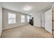 Carpeted bedroom features multiple windows, neutral paint, and ample space at 1211 Croft Dr, Fort Mill, SC 29708
