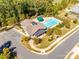 Aerial view of a community pool with ample parking and a nearby clubhouse at 1211 Croft Dr, Fort Mill, SC 29708