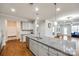 Spacious kitchen island with granite countertop and stainless steel dishwasher overlooking living area at 1211 Croft Dr, Fort Mill, SC 29708