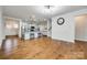 Open-concept living room and kitchen with hardwood floors and stainless steel appliances at 1211 Croft Dr, Fort Mill, SC 29708