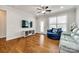 Bright living room with hardwood floors, ceiling fan, and large window at 1211 Croft Dr, Fort Mill, SC 29708
