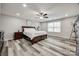 Spacious main bedroom with luxury vinyl plank flooring, ceiling fan, and ample natural light at 1211 Croft Dr, Fort Mill, SC 29708