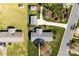 Stunning aerial view of home, driveway, and beautifully landscaped yard with mature trees and greenery at 1228 Graystone Dr, Gastonia, NC 28054