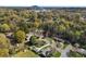 Picturesque aerial featuring a neighborhood with lush greenery and mountain backdrop at 1228 Graystone Dr, Gastonia, NC 28054